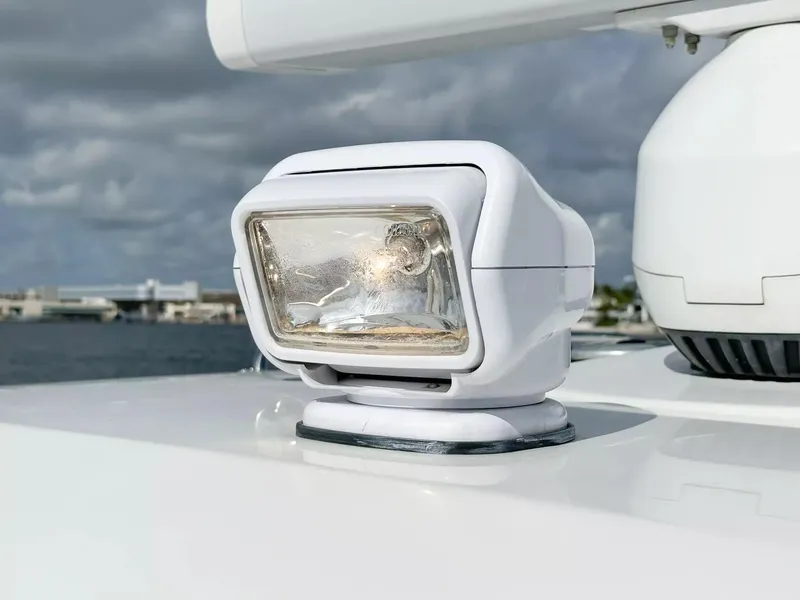 Slide: The Image of Close-up of spotlight on 2020 Boston Whaler 325 Conquest boat. - 23