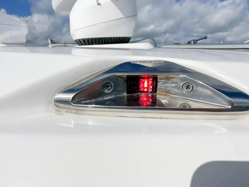 Slide: The Image of 2020 Boston Whaler 325 Conquest navigation light with radar in background. - 25