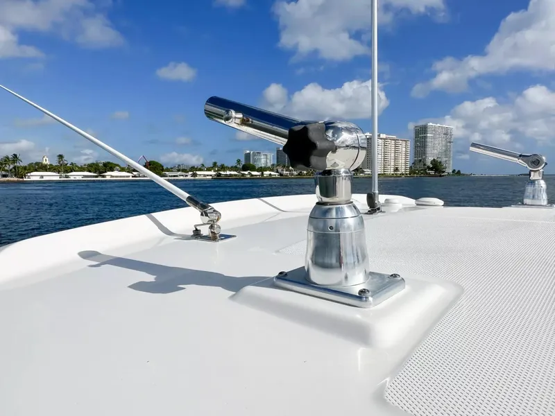 Slide: The Image of Close-up of 2020 Boston Whaler 325 Conquest boat deck with ocean and cityscape background. - 26