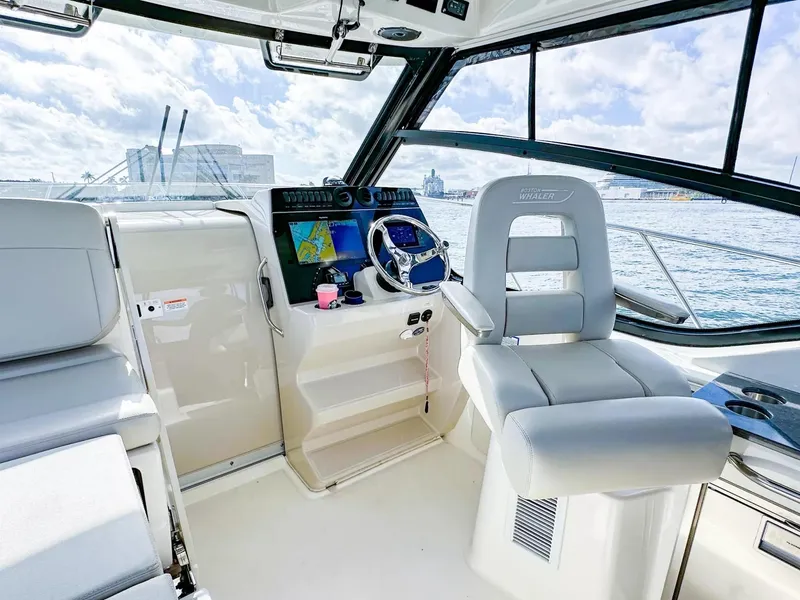 Slide: The Image of 2020 Boston Whaler 325 Conquest helm with modern navigation system and comfortable seating. - 28