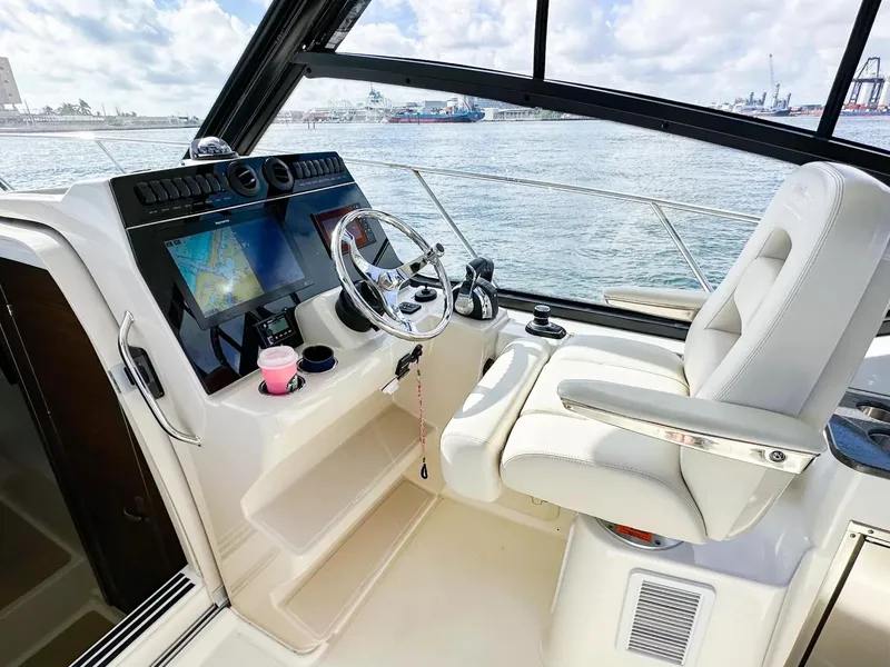 Slide: The Image of 2020 Boston Whaler 325 Conquest helm with navigation system and captain's chair. - 30