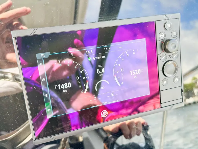 Slide: The Image of Close-up of the 2020 Boston Whaler 325 Conquest digital dashboard display. - 35