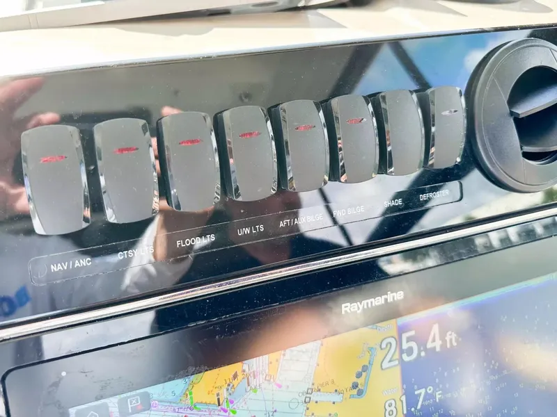 Slide: The Image of Control panel of a 2020 Boston Whaler 325 Conquest boat with Raymarine display. - 37