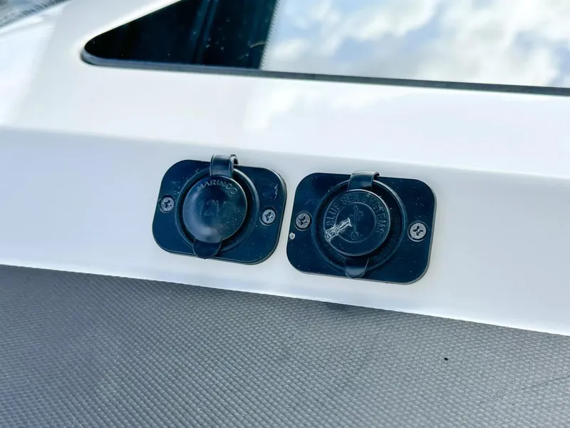 Slide: The Image of Close-up of power outlets on a 2020 Boston Whaler 325 Conquest boat. - 40