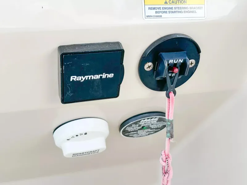 Slide: The Image of Control panel of a 2020 Boston Whaler 325 Conquest boat featuring Raymarine equipment. - 48