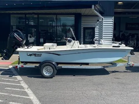 The Image of 2024 Mako Pro Skiff 15 CC boat on trailer outside dealership. - 0