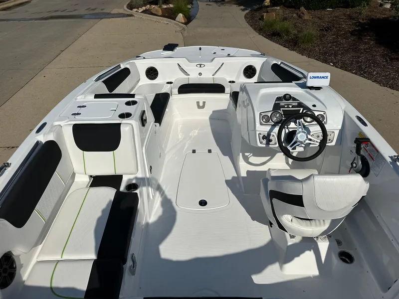 Slide: The Image of 2024 Tahoe 1950 boat interior with modern dashboard and seating. - 8