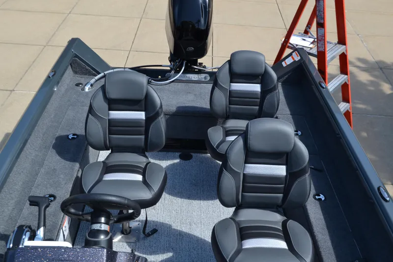 Slide: The Image of 2024 Ranger VS1665SC boat interior with four cushioned seats and steering console. - 3