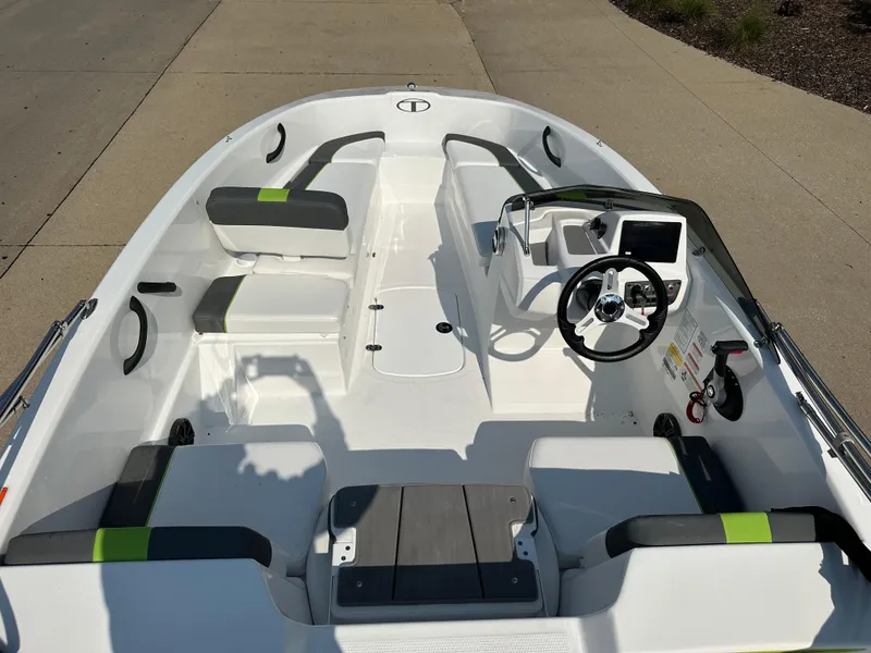 Slide: The Image of 2024 Tahoe T16 boat interior with modern seating and steering console. - 3