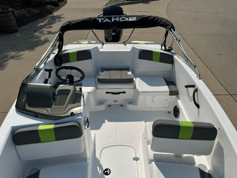 Slide: The Image of 2024 Tahoe T16 boat interior with modern seating and steering wheel. - 5