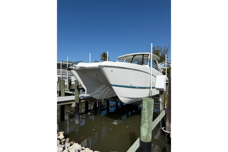 The Image of 2026 World Cat 325 DC boat docked, showcasing sleek design and modern features. - 0