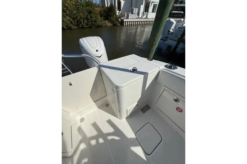 Slide: The Image of 2026 World Cat 325 DC boat interior, featuring storage compartments and sleek design. - 25