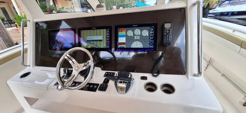 Slide: The Image of 2019 Altima Xcape Sport 38 SFE dashboard with steering wheel and navigation screens. - 15
