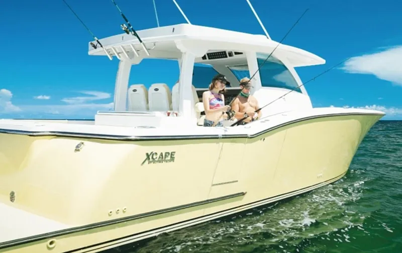 Slide: The Image of 2019 Altima Xcape Sport 38 SFE boat with people fishing on a sunny day. - 7