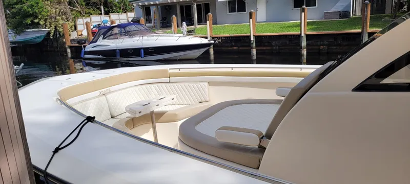 Slide: The Image of 2019 Altima Xcape Sport 38 SFE boat docked near waterfront homes. - 8