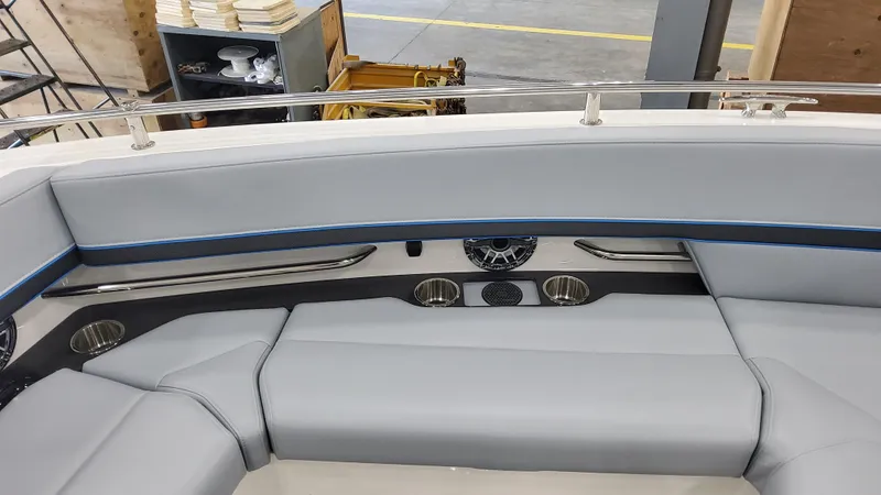 Slide: The Image of 2025 Formula 380 Super Sport Crossover OB boat interior with grey seating and cup holders. - 24