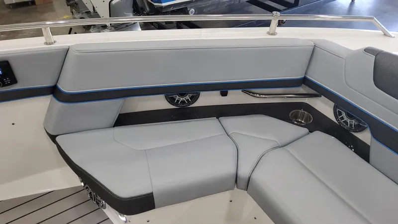 Slide: The Image of 2025 Formula 380 Super Sport Crossover OB interior seating with gray upholstery and blue accents. - 26