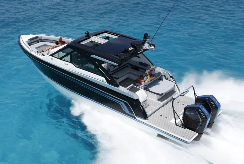 Slide: The Image of 2025 Formula 380 Super Sport Crossover OB cruising on clear blue water. - 3