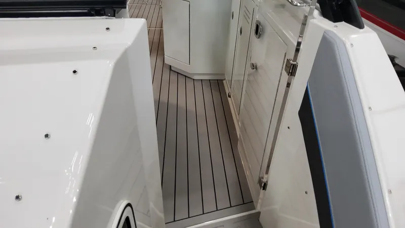 Slide: The Image of 2025 Formula 380 Super Sport Crossover OB boat interior with sleek flooring and cabinetry. - 30