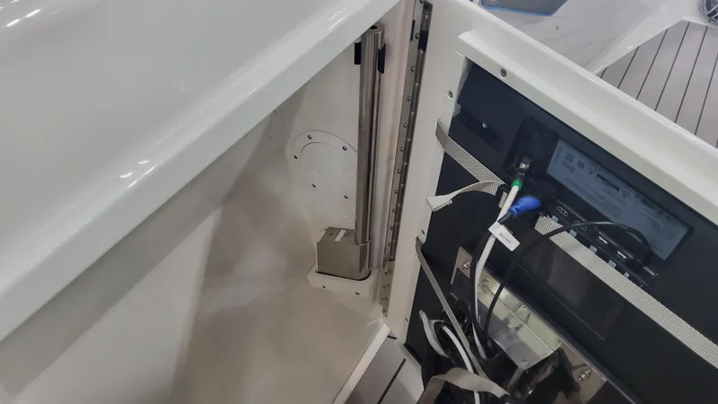 Slide: The Image of 2025 Formula 380 Super Sport Crossover OB interior compartment with wiring and components. - 32