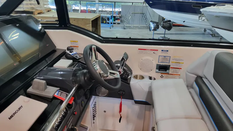 Slide: The Image of 2025 Formula 380 Super Sport Crossover OB cockpit with steering wheel and control panel. - 37