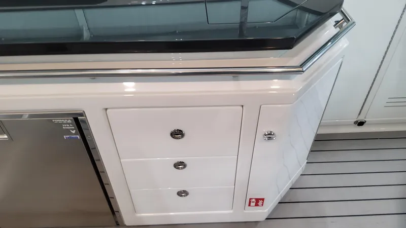 Slide: The Image of 2025 Formula 380 Super Sport Crossover OB interior, featuring sleek cabinetry and modern design. - 40