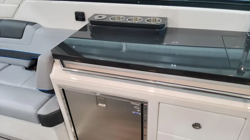 Slide: The Image of Interior of 2025 Formula 380 Super Sport Crossover OB with mini fridge and seating. - 41