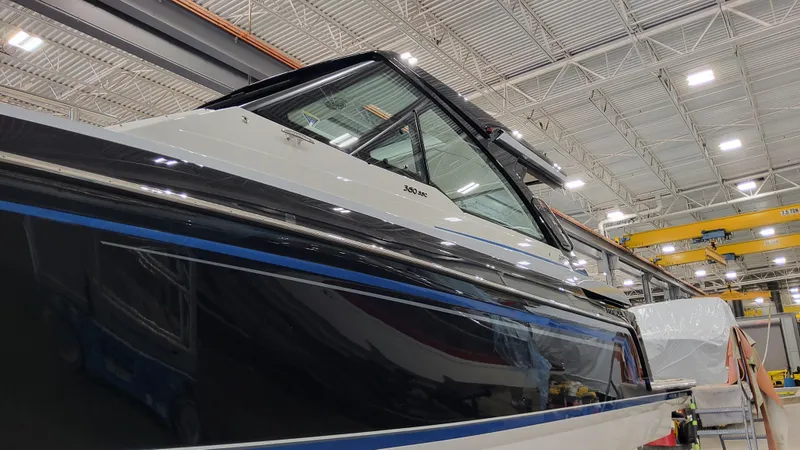 Slide: The Image of 2025 Formula 380 Super Sport Crossover OB in a showroom. - 5