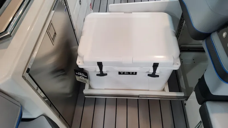 Slide: The Image of 2025 Formula 380 Super Sport Crossover OB interior with Yeti cooler on slide-out tray. - 52