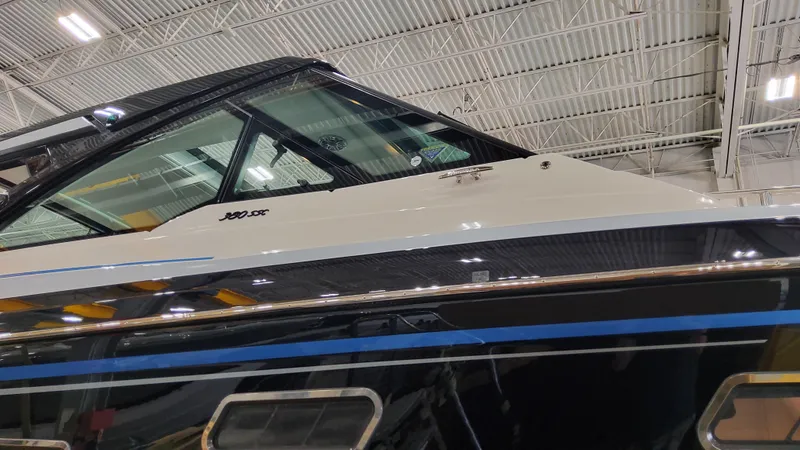 Slide: The Image of 2025 Formula 380 Super Sport Crossover OB boat in a showroom. - 6