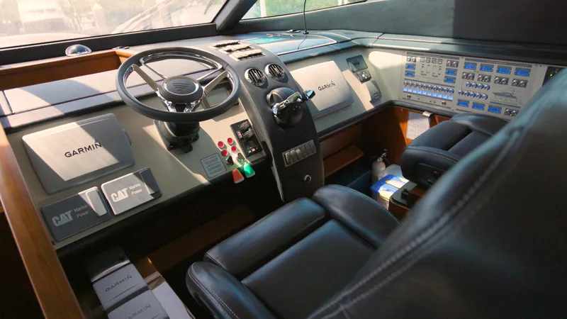 Slide: The Image of 2014 Fairline Squadron 78 Custom yacht cockpit with advanced navigation controls. - 16