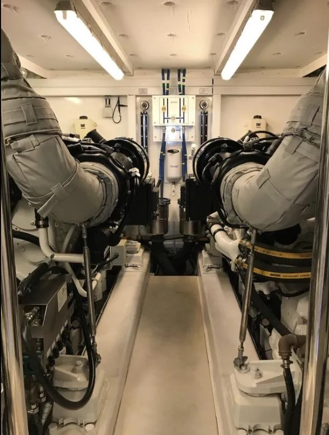 Slide: The Image of Engine room of 2014 Fairline Squadron 78 Custom yacht, showcasing dual engines and mechanical systems. - 35