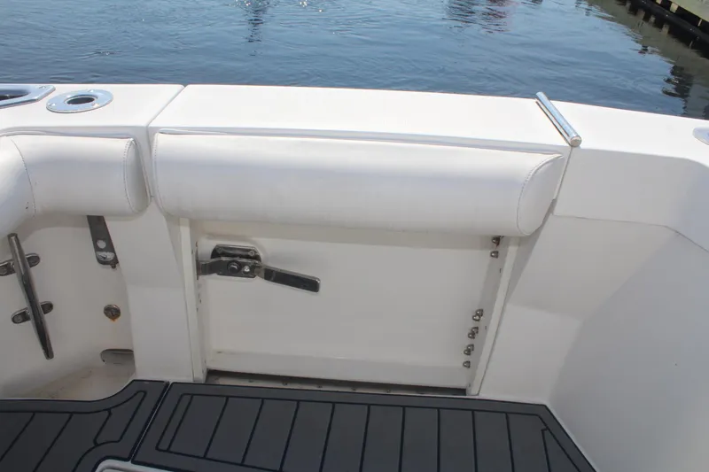 Slide: The Image of 2013 Cabo 40 Hardtop Express boat deck with cushioned seating and water view. - 11