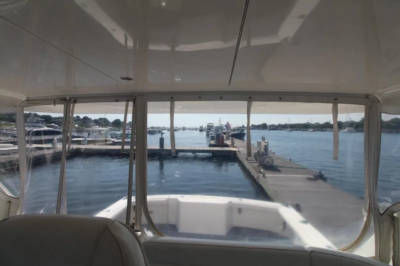 Slide: The Image of Interior view from a 2013 Cabo 40 Hardtop Express yacht at a marina. - 23