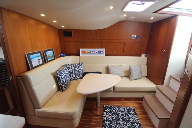 Slide: The Image of Luxurious interior of 2013 Cabo 40 Hardtop Express yacht with elegant seating and decor. - 28