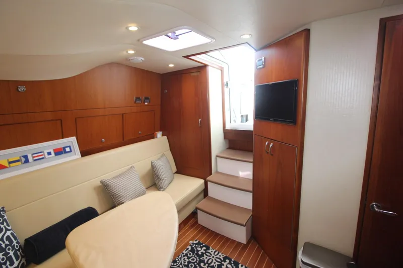 Slide: The Image of Interior of 2013 Cabo 40 Hardtop Express yacht with cozy seating and modern amenities. - 33