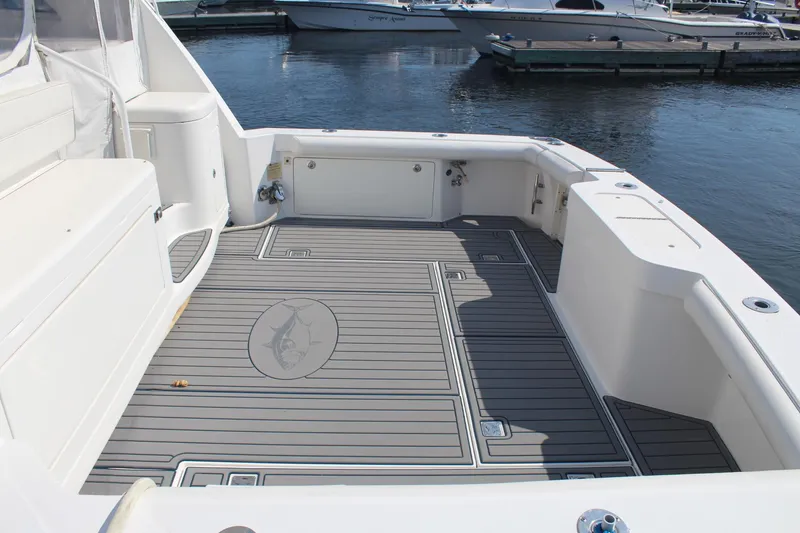 Slide: The Image of 2013 Cabo 40 Hardtop Express boat deck with sleek design and spacious layout. - 7