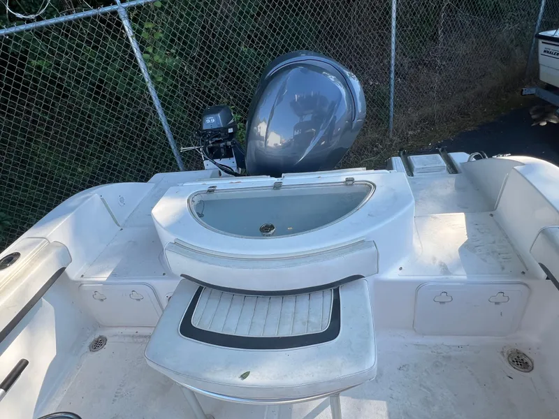 Slide: The Image of 2011 Sea Fox 236CC Pro Series boat with outboard motor and seating area. - 16