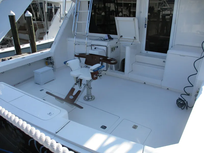 Slide: The Image of Bertram 60 Convertible 2000 yacht deck with fishing chair and ladder. - 12