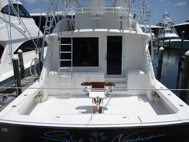 Slide: The Image of Bertram 60 Convertible 2000 yacht, rear view, docked at marina. - 14