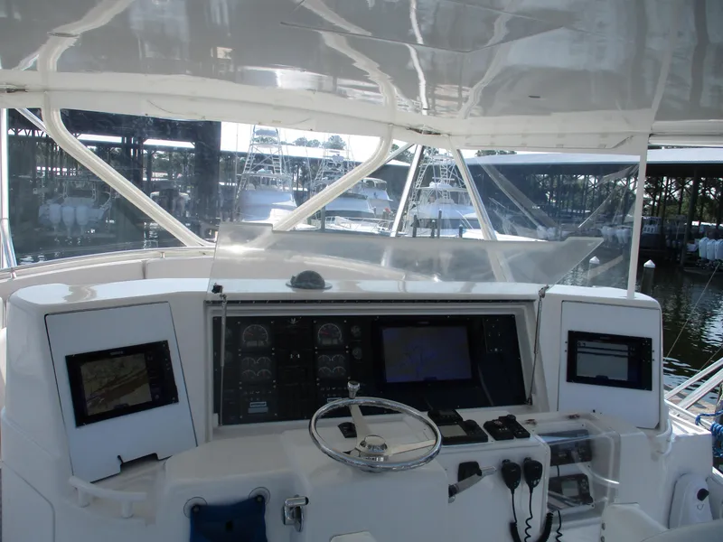 Slide: The Image of Bertram 60 Convertible 2000 yacht helm with navigation equipment and steering wheel. - 20