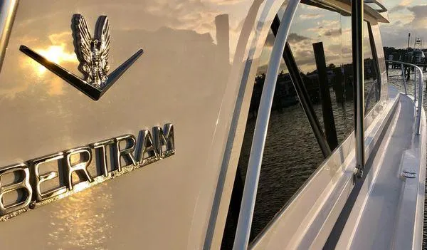 Slide: The Image of Close-up of 2000 Bertram CNV boat at sunset on the water. - 30