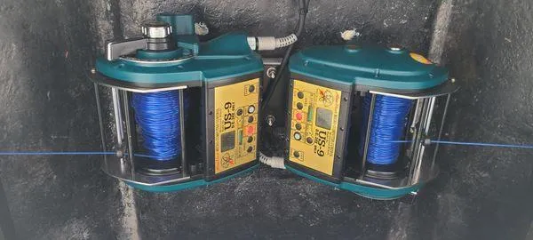 Slide: The Image of Bertram CNV 2000 fishing reels with blue line, mounted on a boat. - 31