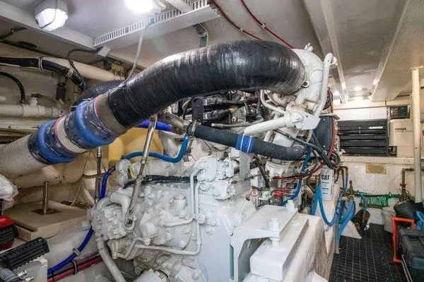 Slide: The Image of Engine room of a 2000 Bertram CNV boat with visible machinery and piping. - 33