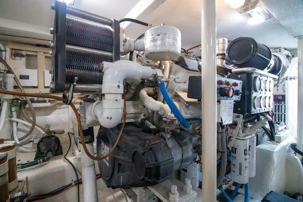 Slide: The Image of Engine room of a 2000 Bertram CNV boat with CAT engine and components. - 38