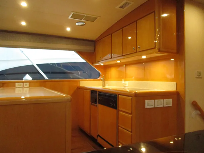 Slide: The Image of Interior of 2000 Bertram 60 Convertible yacht with modern kitchen cabinetry. - 44