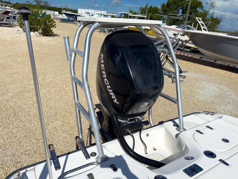 Slide: The Image of 2007 Boston Whaler 220 Dauntless with Mercury outboard motor in a boatyard. - 12