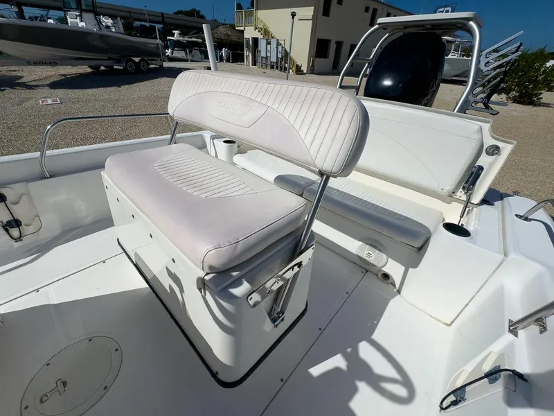 Slide: The Image of 2007 Boston Whaler 220 Dauntless boat interior with seating and storage. - 15