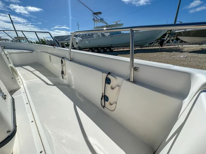 Slide: The Image of 2007 Boston Whaler 220 Dauntless boat interior with stainless steel railings. - 21