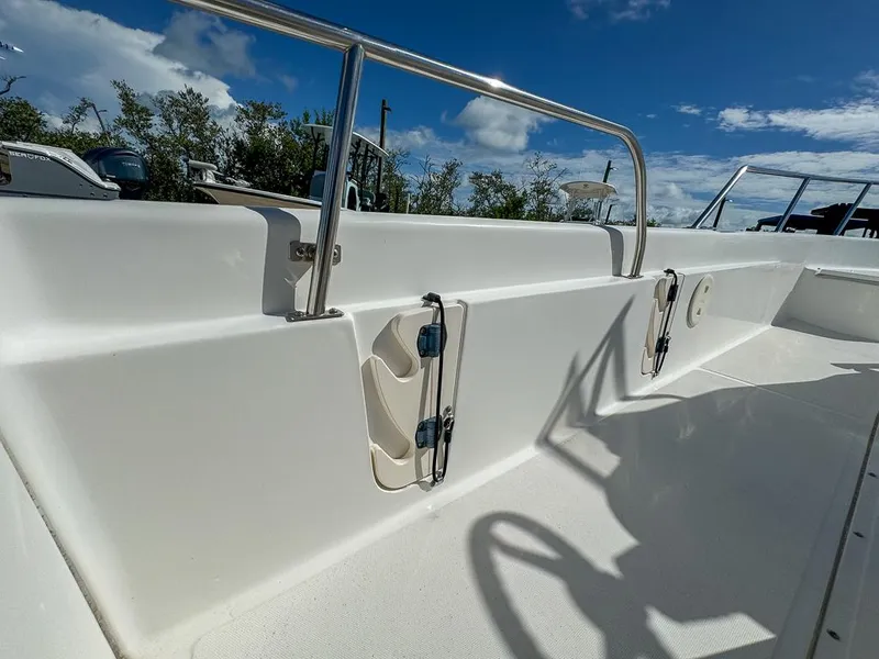 Slide: The Image of 2007 Boston Whaler 220 Dauntless boat interior with stainless steel railings. - 22